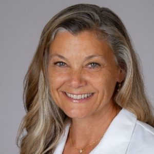 Christianne Heck, MMM, DMD, FAES, MD